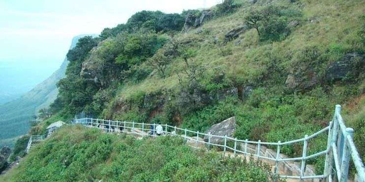 path of Bengalur and Chikmagalur with a railing on a hill