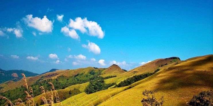 A breathtaking view of the Western Ghats, with lush green mountains and hills.