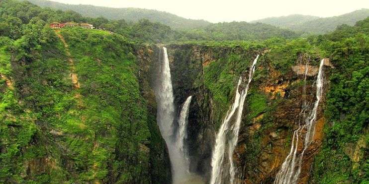 a Manikyadhara waterfall in the middle of a forest in Chikmagalur