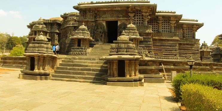 An ancient temple with stone pillars and steps, showcasing the architectural marvel of the past.