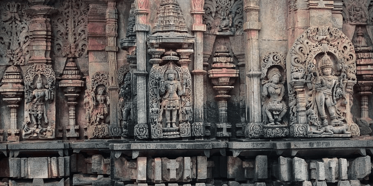 Intricate carvings adorn the temple walls, showcasing exquisite craftsmanship and attention to detail.