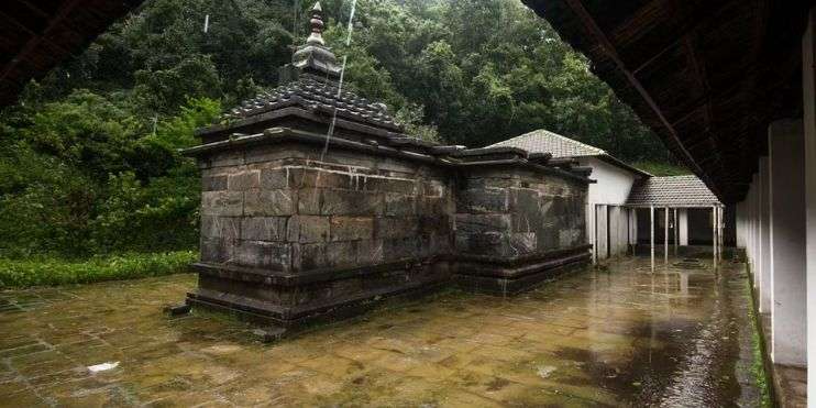 A small temple in a forest, 12th-century fort on the way to Bandaje Falls, offering stunning views for photography and exploration.