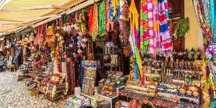 A vibrant street market with colorful items on display