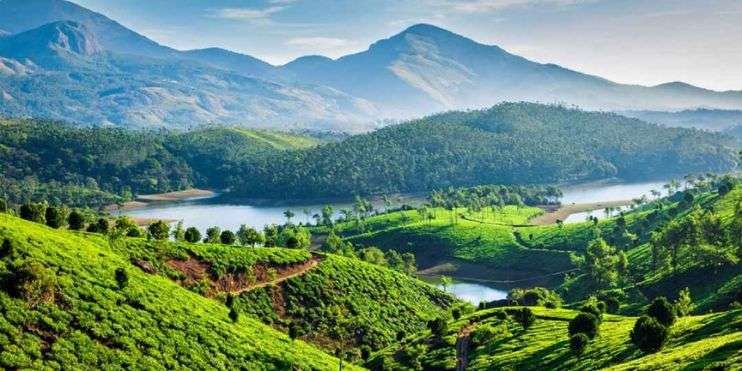 Breathtaking view of Munnar and Kerala's hills, adorned with tea plantations, offering rich cultural experiences and local interactions.