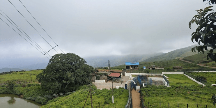 Scenic hillside village with the Guru Dattatreya Bababudan Swamy Darga, showcasing tranquil rural life and natural beauty.