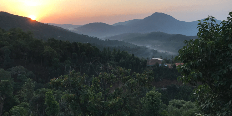 A breathtaking sunrise illuminates the mountains, showcasing the scenic beauty of Kalasa, your gateway to nature's wonders.