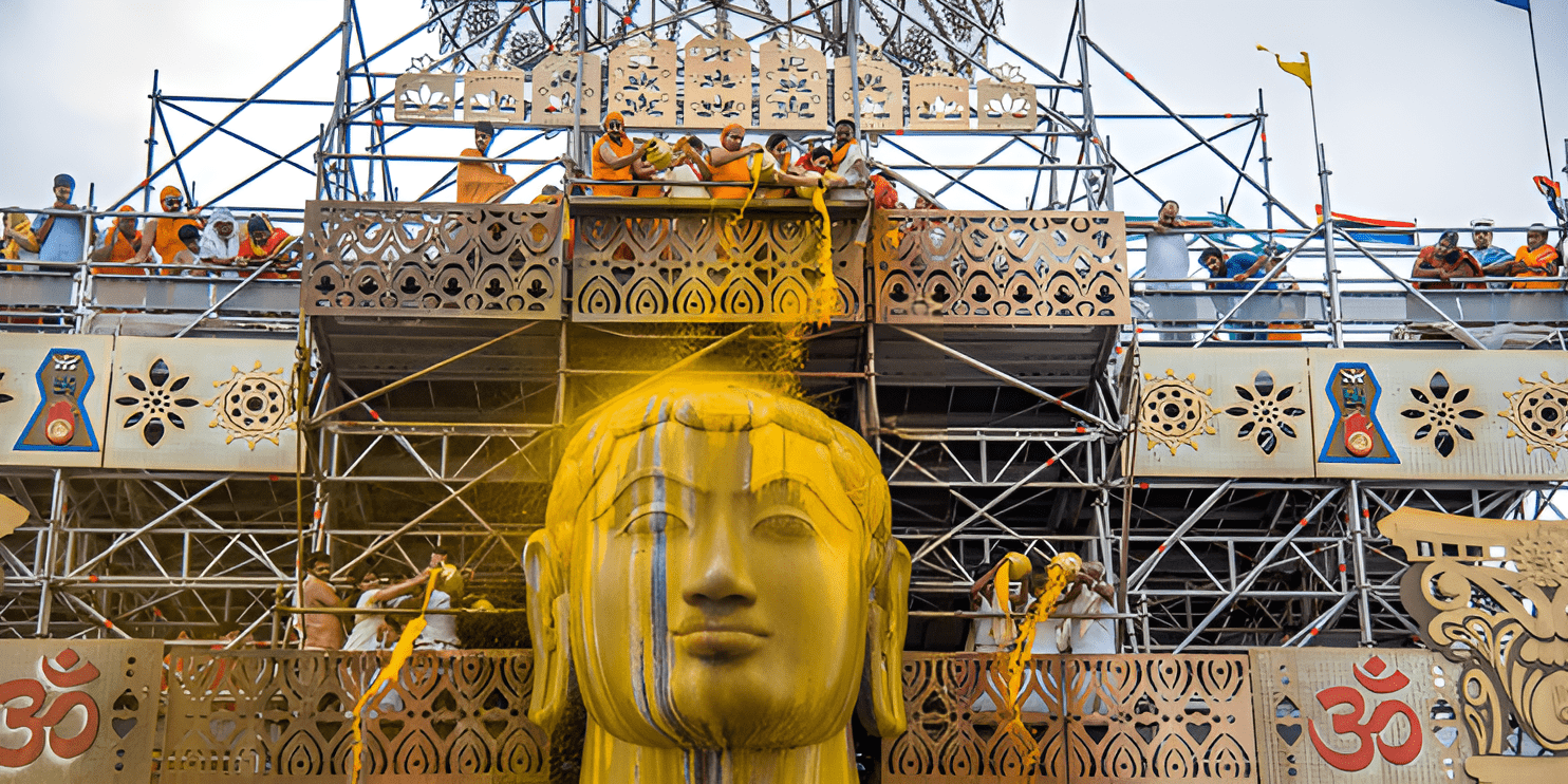 A large golden Buddha statue under construction, symbolizing spiritual significance and cultural heritage.