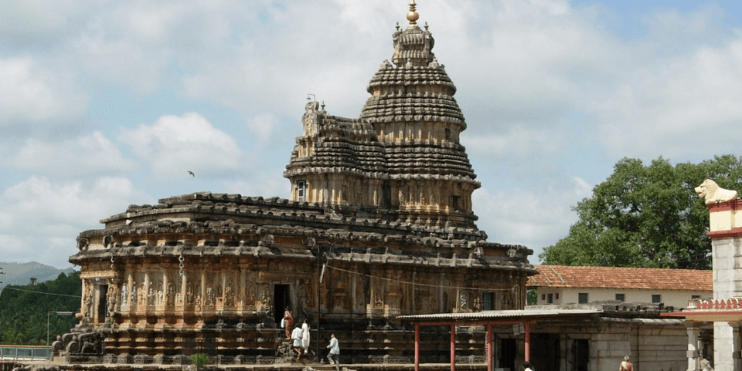 A large temple with a prominent tower, dedicated to Goddess Sharada, in the serene setting of Sringeri.