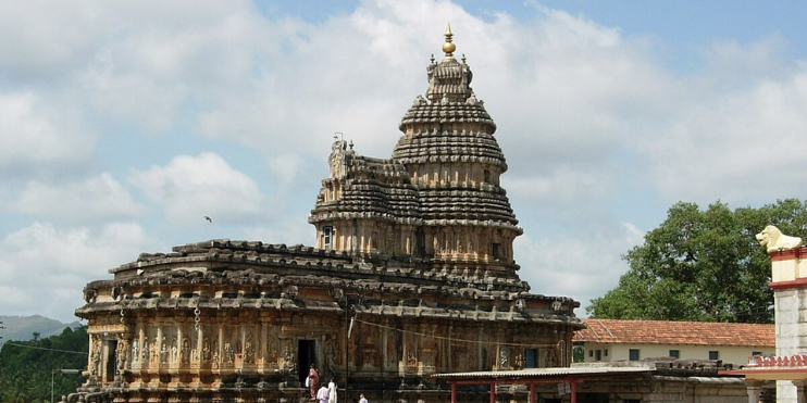 Sringeri Sharada Peetham, a large temple with an impressive tower at its center, exemplifying traditional architecture.