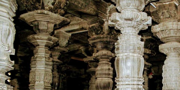 Intricately carved Narasimha Pillar in Chennakeshava Temple, showcasing ancient architectural innovation and Hoysala artistry.