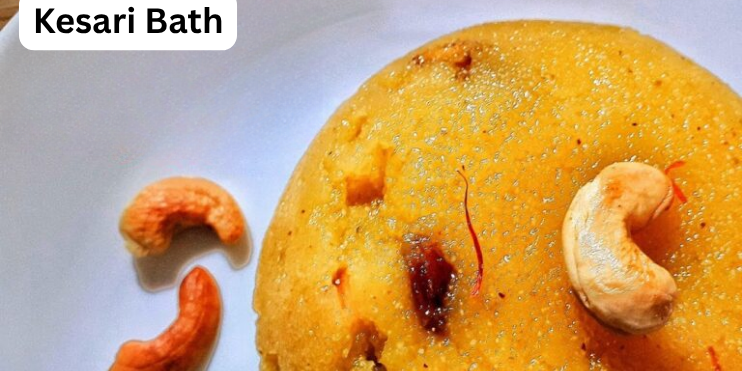 A bowl of Kesari Bath, a sweet dish made with semolina, ghee, sugar, and saffron, garnished with nuts and raisins.