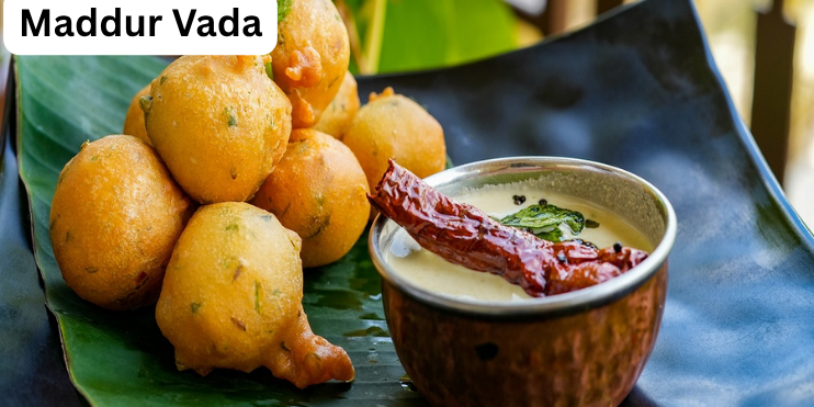 Crispy Maddur Vada made with rice flour, semolina, onions, and spices, served with coconut chutney and tea.